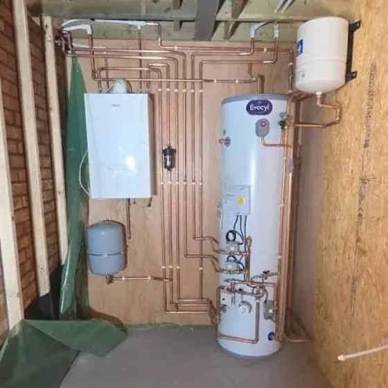 Unvented hot water cylinder installed with copper pipework